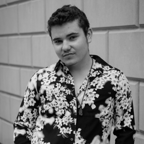 Adrian is a white with short, light brown hair